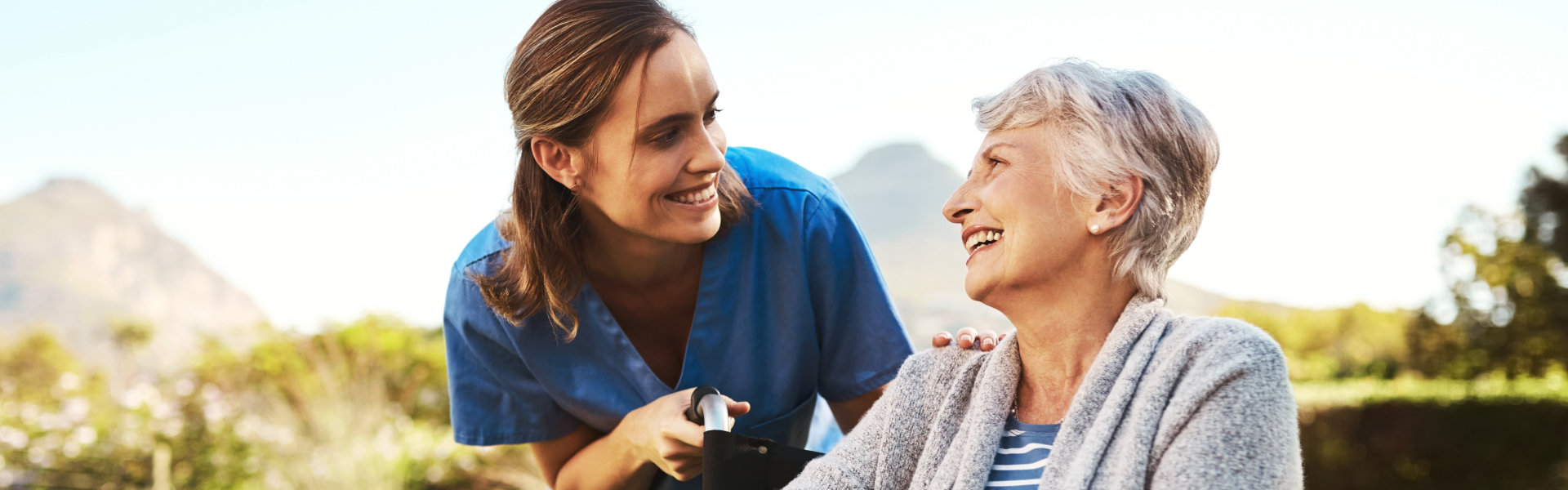 caregiver and senior woman spending time outside